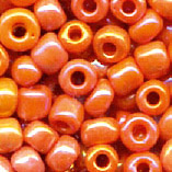 Rocailles im Döschen, 2,5mm, orange/irisierend